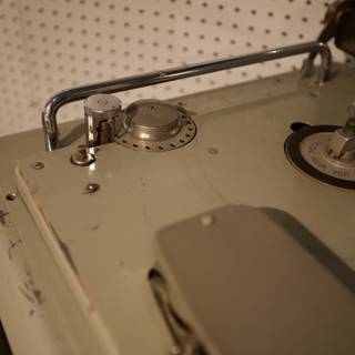 Antique Spoke Machine with Metal Handle