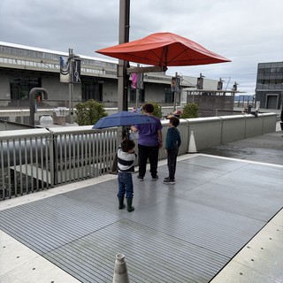 Family Moment on Modern Urban Rooftop Terrace