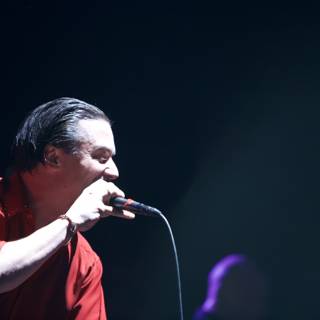 Red Shirted Singer Rocks the Mic at Coachella