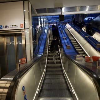 Modern Underground Transit Station with Blue Escalators
