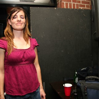 Woman with Eyes Closed at Live Music Venue