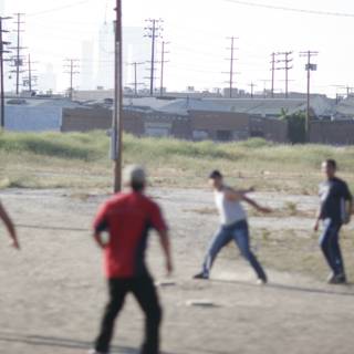 Group Baseball Game in Dirt Field