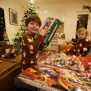 Excited Boy with Christmas Presents on Holiday Morning