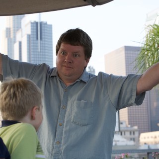 Man Gestures Dramatically with Kids in City