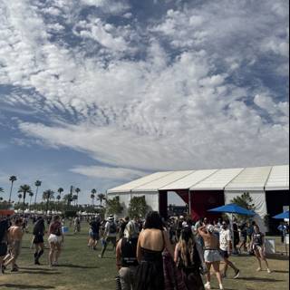 Vibrant Crowd Under Cloudy Skies