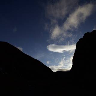 Majestic Cumulus Cloud Over Mountain Range