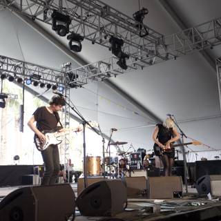 Band rocking the Coachella stage in a tent