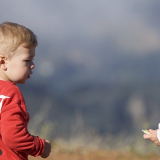 Two Young Boys in a Standoff Outdoors