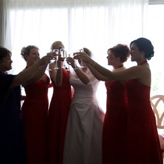 Toasting in Red Dresses