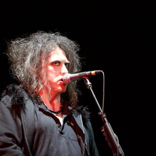 Robert Smith performs with the Cure at the O2 Arena