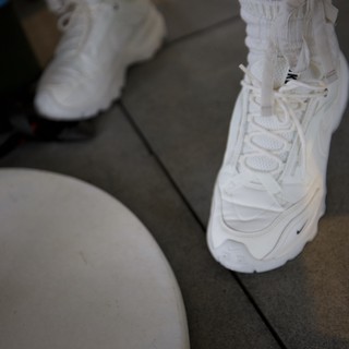 White Nike Sneakers and Minimalist Fashion Detail