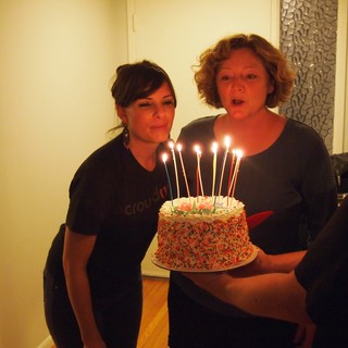 Birthday Wishes: Two Women Blowing Out Candles Together