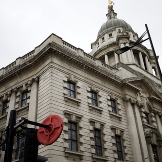 Historic London Building with Golden Dome Under Overcast Sky