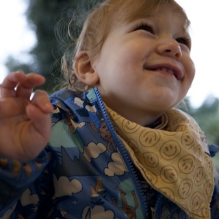 Joyful Toddler Making a Silly Face Indoors
