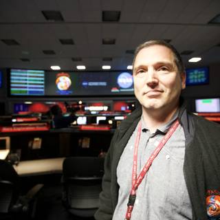 Man with 5 Monitor Setup for Mars Lander Mission
