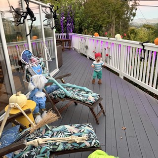 Halloween Decorated Deck with Toddler in Foggy Setting