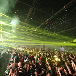 Massive Crowd Electrified by Green Laser Light Show