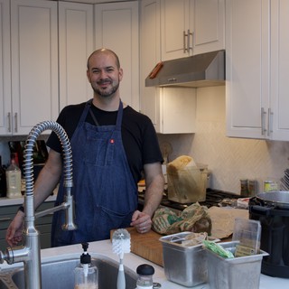 Home Chef Preparing Christmas Eve Dinner in Modern Kitchen