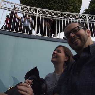 Playful Low-Angle Selfie on Urban Steps Below Railing