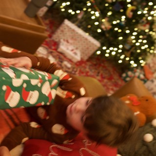 Cozy Christmas Morning Gift Opening by the Tree