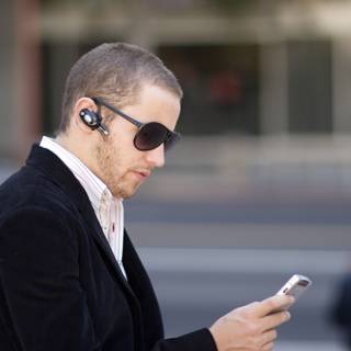 Sunglasses, Suit and a Mobile Phone