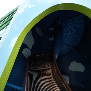 Whimsical Rainbow Slide Through Pastel Sky Portal