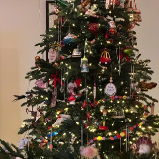 Festively Decorated Christmas Tree with Eclectic Ornament Collection