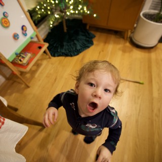 Toddler's Surprised Expression on Christmas Morning