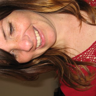Joyful Woman Smiling Downward on Christmas Day