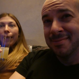 Couple Enjoying Drinks Together at Restaurant
