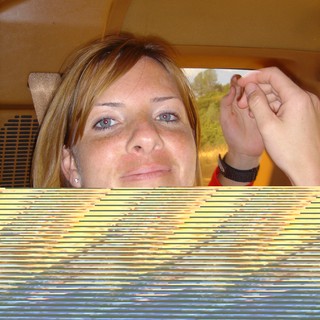 Penelope's Playful Glance in a Yellow Car Interior