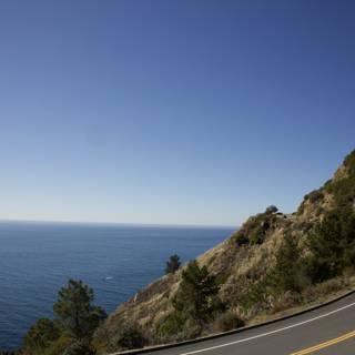 Embracing Serenity - Mountain, Road, and Sea