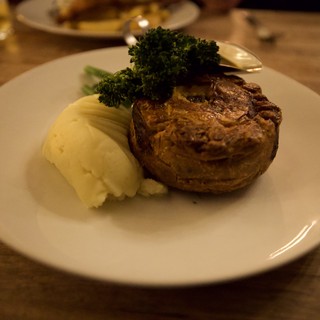 Traditional British Meat Pie with Mash and Broccoli