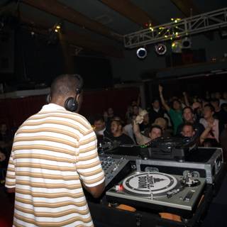 Nightclub Beats: DJ Kenny Ken Entertaining the Crowd