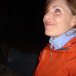 Woman Gazing Upward on a Dark Winter Night