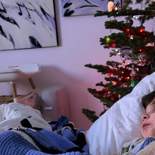 Child Gazing at Christmas Tree on Winter Morning