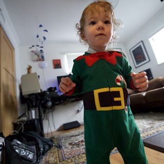 Toddler in Festive Elf Costume at Home