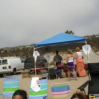 Beach BBQ Gathering Under a Tent