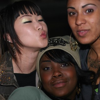 Four Friends Posing Together at a Nightlife Event
