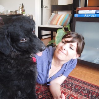 Woman and Her Black Dog Share a Playful Moment