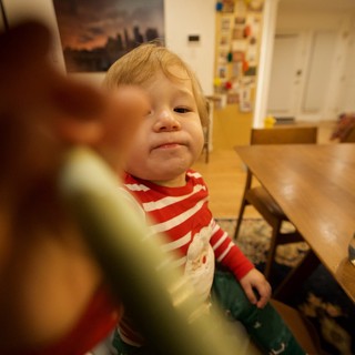 Young Child in Motion at Kitchen Table