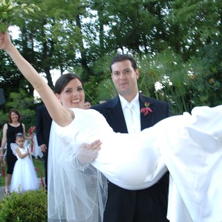 Groom Carries Bride in Joyful Wedding Celebration