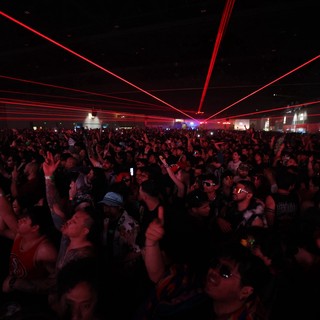 Red Laser Light Show Over Massive EDM Festival Crowd