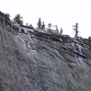 Dramatic Layered Rock Face in Snowy Winter Landscape