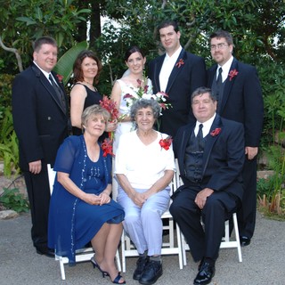 Family Wedding Portrait in Lush Garden Setting