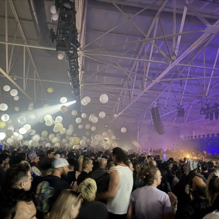 Skrillex Concert Crowd Under Purple Stage Lights