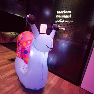 Whimsical Inflatable Snail Art Installation at Museum