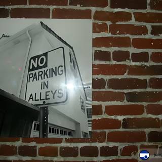 No Parking on Brick Wall