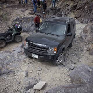 Black Land Rover on a Rocky Adventure