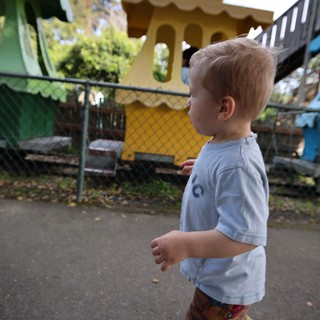 Young Boy Exploring Colorful Playground at Fantasyland